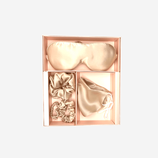 Indulge in Luxury with Our Champagne Color Silk Gift Set - The Perfect Treat for Yourself or a Loved One. Handmade in Suzhou, China, the Home of Mulberry Silk. Oeko-Tex® Certified for Safe and Healthy Use. Proven to Benefit Hair and Skin Health, Especially for Those with Allergic or Dehydrated Skin. Set Includes: 1 Sleeping Mask, 1 Face Mask, and 3 Scrunchies in a Beautiful Champagne Color.