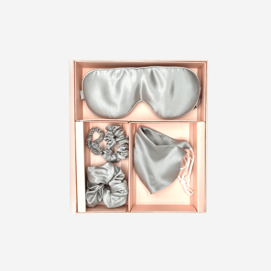 Stay Safe and Stylish with Our Silver Grey Silk Gift Set - University of Cincinnati Research Shows Silk is Most Effective at Preventing Aerosol Droplets from Penetrating Masks. Handmade in Suzhou, China, the Home of Mulberry Silk. Oeko-Tex® Certified for Safe and Healthy Use. Proven to Benefit Hair and Skin Health, Especially for Those with Allergic or Dehydrated Skin. Set Includes: 1 Sleeping Mask, 1 Face Mask, and 3 Scrunchies in the Chic Silver Grey Color.