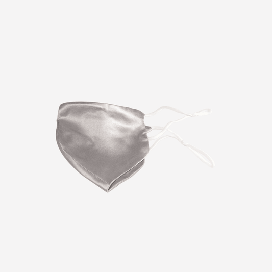 Stay Protected in Style with Our Silver Grey 100% Mulberry Silk Face Mask - Handmade with High-Quality Silk for Optimal Comfort. Adjustable, Breathable and Skin-Friendly. Oeko-Tex® Certified for Safe and Eco-Friendly Use. Crafted in Suzhou, the Capital of Mulberry Silk.
