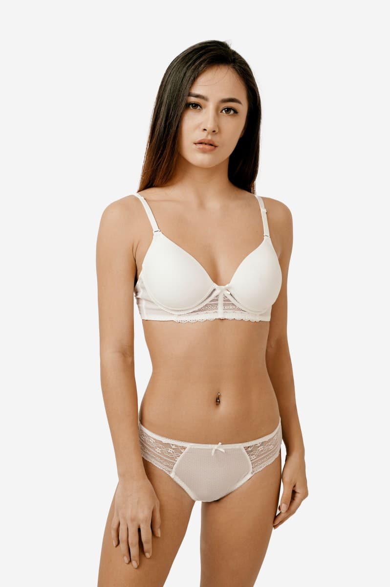 Shop the Basic Lace Bikini for ultimate comfort and a charming look with lace accents. Made of 92% Polyester & 8% Polyurethane with a 65% Polyester, 35% Cotton gusset. Machine washable. Available in Ivory.