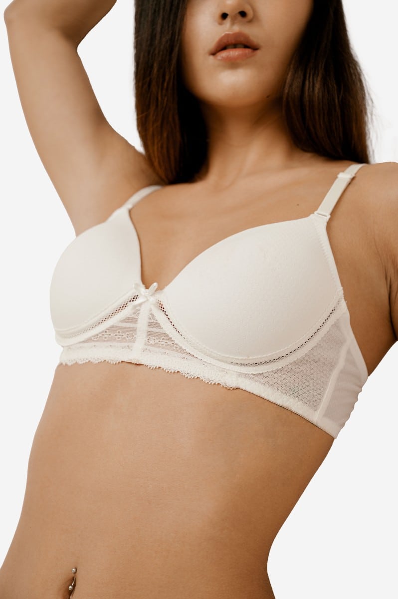 Ivory Basic Lace Wireless Bra with Breathable Mesh Lightweight and comfortable with pretty lace accents, this wireless bra is a must-have for every wardrobe. The adjustable straps and back hook-and-eye closures ensure a personalized fit. Made of a blend of 92% Polyester and 8% Polyurethane, this bra is both soft and durable. Hand wash only for optimal care. Get the perfect fit and support with this beautiful lace bra.
